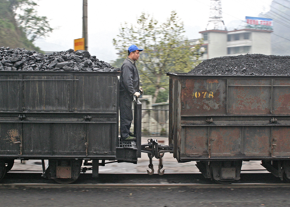 Intermediate Brakeman
Coal trains (and, indeed, passenger trains) on this highly agreeable metre gauge system have no through brakes and downhill trains rely on a number of intermediate brakemen riding shotgun and applying handbrakes as required. Yue Jin, Shibaxi Line, China.

