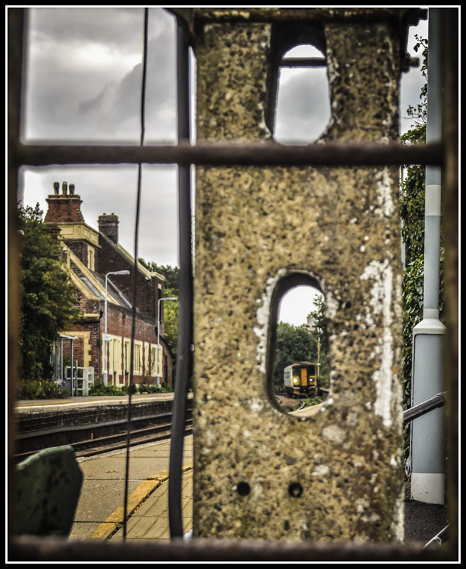 Somerleyton through the Semaphore
An Abellio Greater Anglia Lowestoft to Norwich slows for the stop at Somerleyton, viewed through the concrete lattice of the Norwich bound starter signal.

