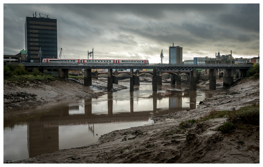 The Briny Usk
An unidentified TfW Coradia Class 175/1 crosses the briny River Usk with 1V95, the 10.41 Holyhead to Llanelli service, about to stop at Newport, South Wales on a dark and foreboding Thursday afternoon in late October.
