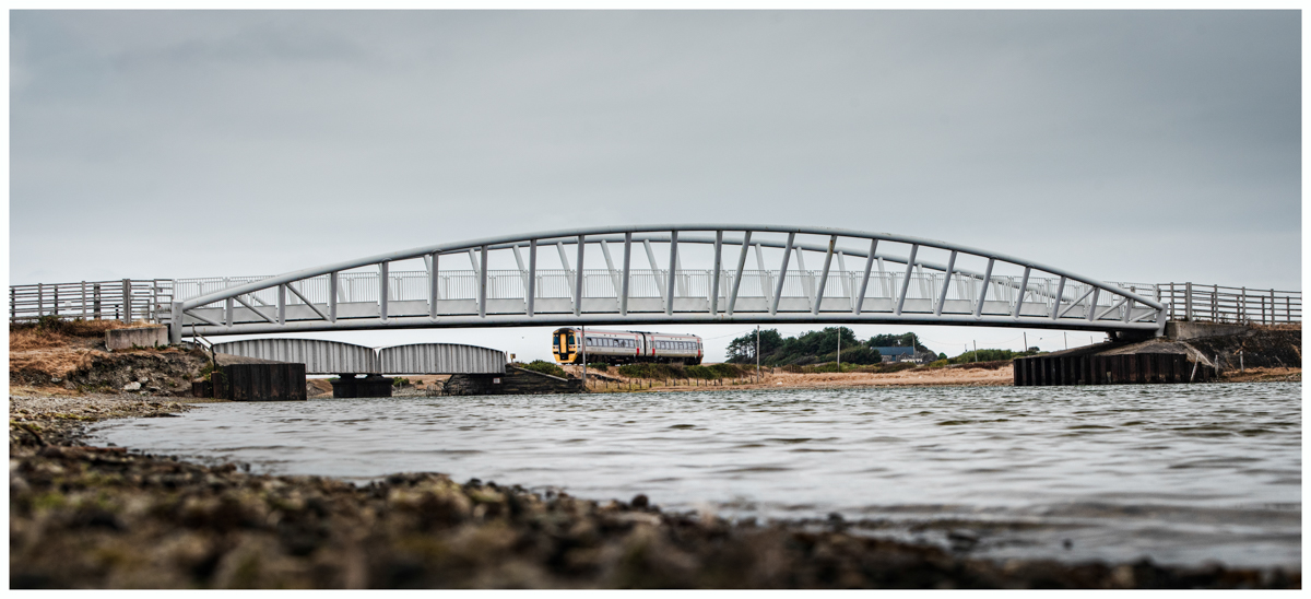 Crossing the Dysynni
158839 working 2J07, the 08.08 Birmingham International to Pwllheli crossing Afon Dysynni between Tywyn and Tonfanau, framed by the Bailey Bridge, Monday 17.8.26
