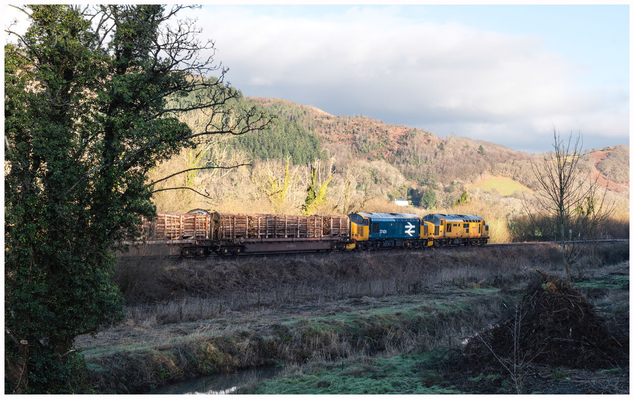 West Wales Timber
97303 with 37424 working 6C56, the 09.50 Aberystwyth Krono Colas to Chirk Kronospan Colas Rail on the approach to Machynlleth, Saturday 17.1.26
