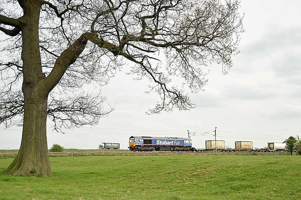 The competitors
Stobart companies crystallise the Road v Rail contest as Stobart Rail liveried Class 66/4 66411 heads north whilst a Stobart lorry heads north on the adjacent M6 motorway at Brock.

