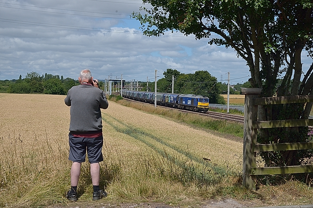 The lineside observer
The passing of Class 60 60026 Helvellyn at Winwick whilst working a Liverpool BT - Drax PS bio-mass service is photographed by a local photographer.

NOTE  :  This local photographer, a regular at Winwick, sadly passed away with a heart attack shortly before Christmas and I have entered this in his memory.  RIP Norman.
