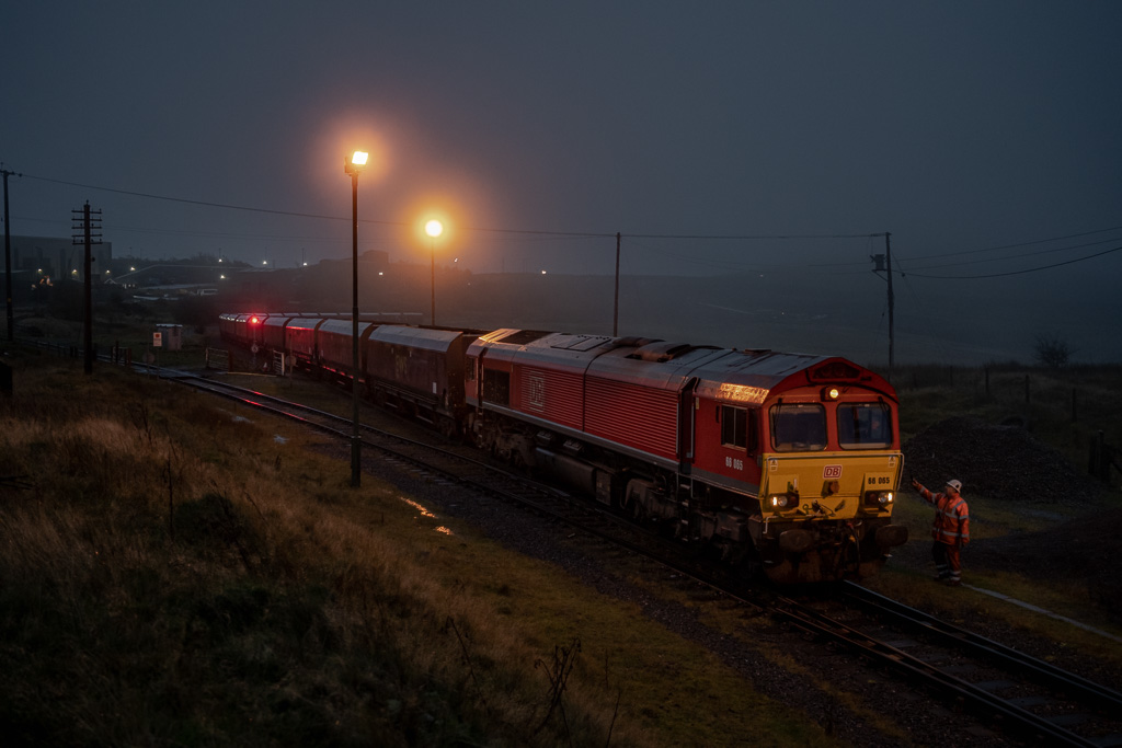 Top of the Valley
The driver of DB Cargo Class 66 No. 66065 receives a radio for shunting operations on arrival at Cwmbargoed Opencast Colliery on a wet and misty early morning with 4C93, the coal empties from Port Talbot steel works on 27th October 2022.
