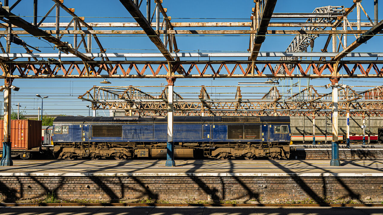 The State of It
Crewe station is looking pretty shabby these days. GBRf Class 66/3 No. 66304 stops for a quick crew change at Crewe working 4M61, the 02:17 Felixstowe North – Ditton intermodal on 29 April 2026.
