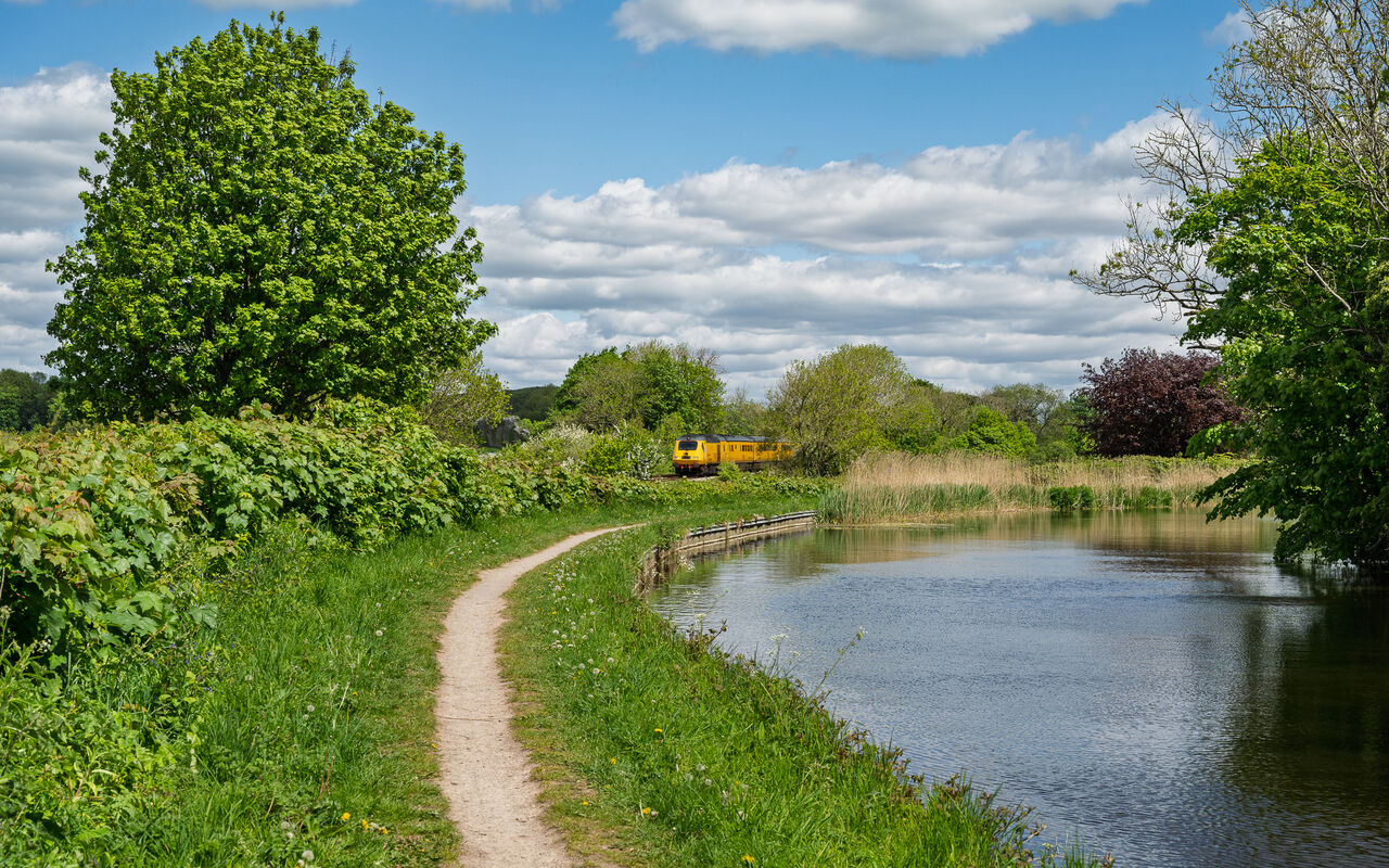 Canalside
Running alongside the Lancaster Canal at Capenwray on the Little North Western line between Settle Junction and Carnforth, a Network Rail test train  works 1Q17, the 09:42 Leicester LIP – Darlington on 10 May 2026.
