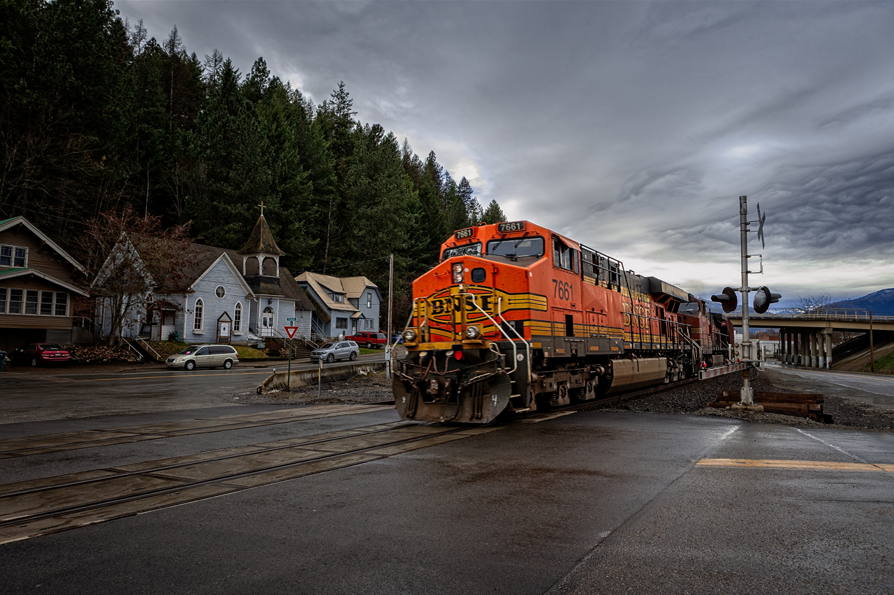 Winter Rain
Bonners Ferry, ID - The read end of a westbound grain train passes through town on its way to the west coast ports with a load of wheat or soybeans.  The power on the trains usually 2 units on the front with two more on the rear, all controlled by the engineer on the headend.
