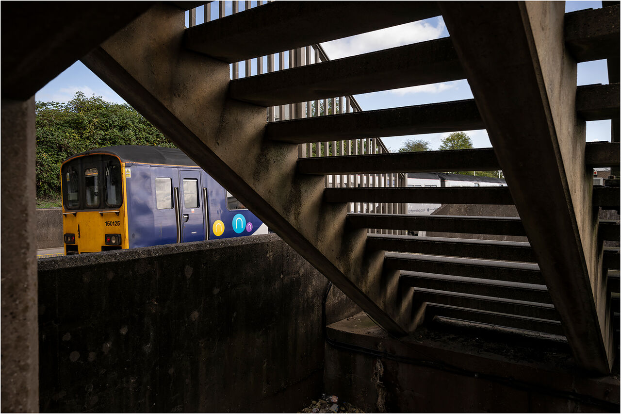 Downstairs at Retford
On the morning of Thursday 17 September 2026, I found myself on the lower platforms at Retford station in Nottinghamshire. Having photographed this unit passing under the East Coast Mainline, I then sought out a more unconventional view of the train. Here is the result. For the record, Northern Rail DMU no. 150125 formed 1L41, the Leeds (0838hrs) to Lincoln service, seen here departing platform 3 at 1020hrs. 
