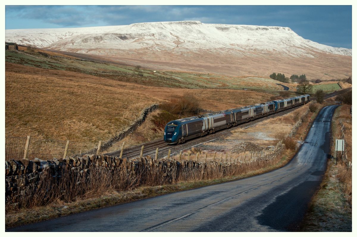 Avanti! 
The Avanti shuttles between Preston and Carlisle created much interest during the first three weeks of January 2026, whilst the west coast main line was closed for an overbridge replacement at Clifton near Penrith, and other associated upgrades. A 10-car 805 'Evero' formation is seen here at Lunds, descending form the summit at Ais Gill. A sprinkling of snow, like icing on a cake, adorns the summit of the impressive Wild Boar Fell in the background.
Keywords: Avanti;Evero;BiMode;Class805;Settle&Carlisle;AisGill