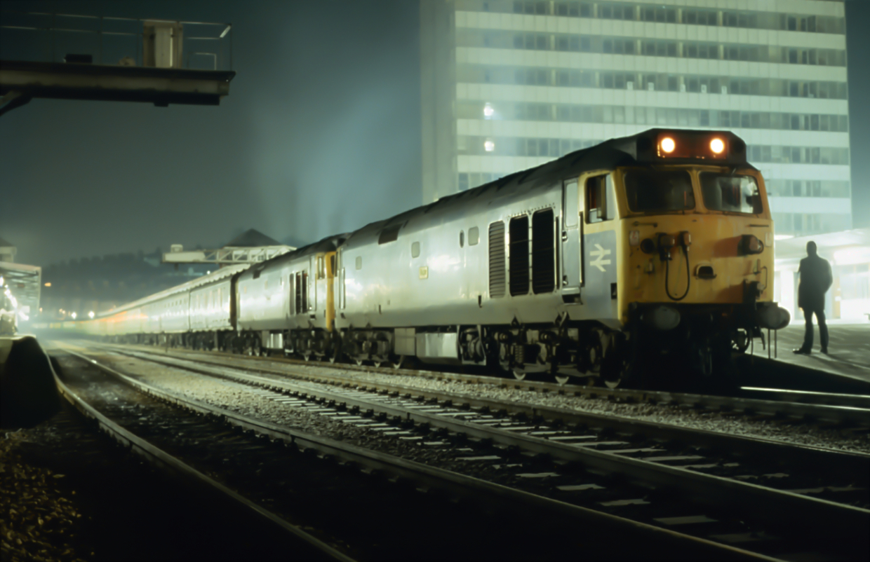 Early Birds
Very early morning on the 26th January 80 as Howe and Revenge get ready to tackle the Cornish banks with the 0005 Paddington Penzance sleepers.
I had joined the train at Taunton having travelled up from Newton Abbot on the up sleepers behind 50029, 50023 was put on top at Exeter and I stayed on board until Plymouth where I grabbed this shot. 50009 to Saltash for a shot of a 50 on the Royal Albert Bridge on a cold misty morning followed by 50035 to St Germans for a shot of 50026 on Teddy Viaduct followed by a day of haulage.
Such were my weekends in my late teens. Combining riding behind class 50s and photography. I don't ever remember being bored and I lived life to the full with an air of excitement about all I did.
The majority of people / staff tolerated us and life was easy. Guards mostly were way too busy drinking coffee from their billy cans and reading newspapers to bother with us. How I miss those days.

