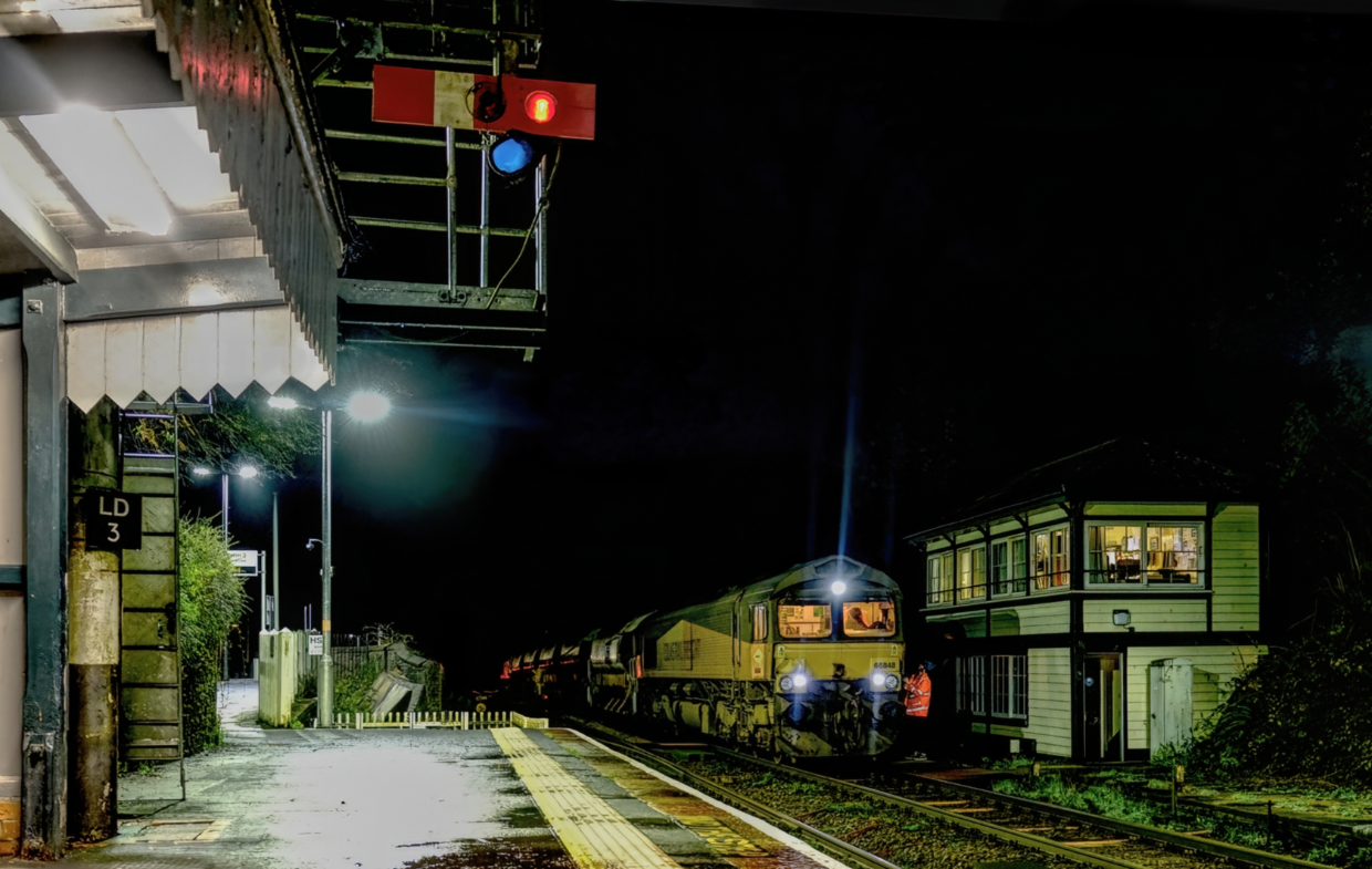 Bobby Briefing.
66848 arrives and pulls up at Liskeard signal box and receives a briefing from the signalman before pulling forward and reversing onto the Looe branch with 5 loaded ballast wagons which formed the 6C43 Westbury to Westbury via Looe.
Freights on the branch are very much a rarity and normally take place under the cover of darkness as did this movement. Night time shots are exceptionally difficult on the branch and i must confess i failed to get a decent shot however i did manage this picture.
66850 was on the rear.
