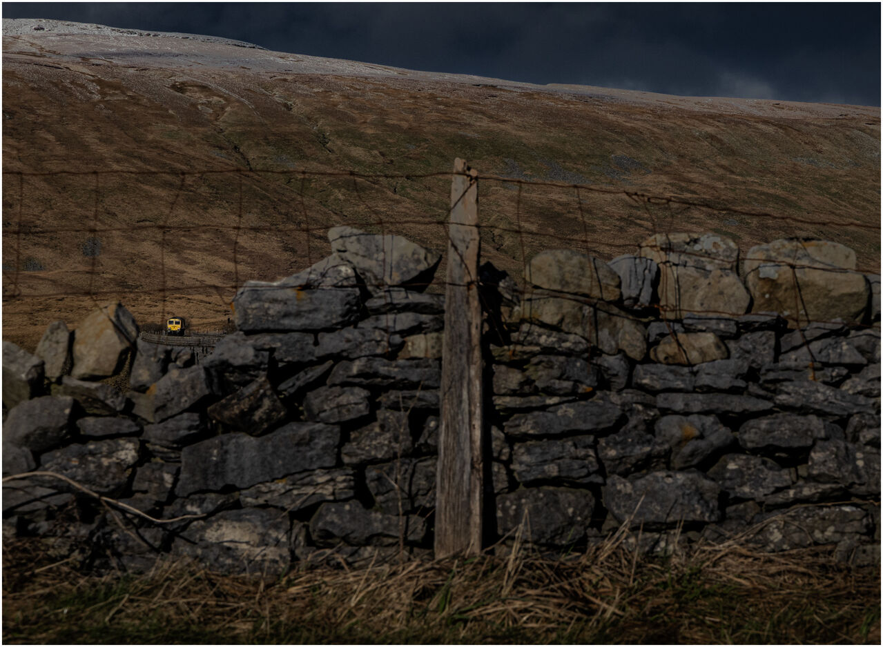 Hitting The Wall
Freightliner's 66419 heads over Ribblehead viaduct on a solo journey to Carlisle.
