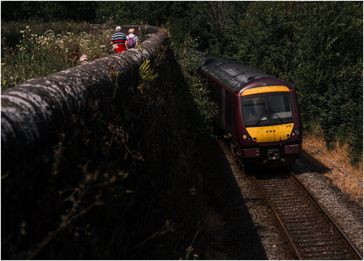 As I Walked Out
EMR 170516 bends round the wall at High Peak Junction unbeknownst to those enjoying a pleasant walk around the area.
